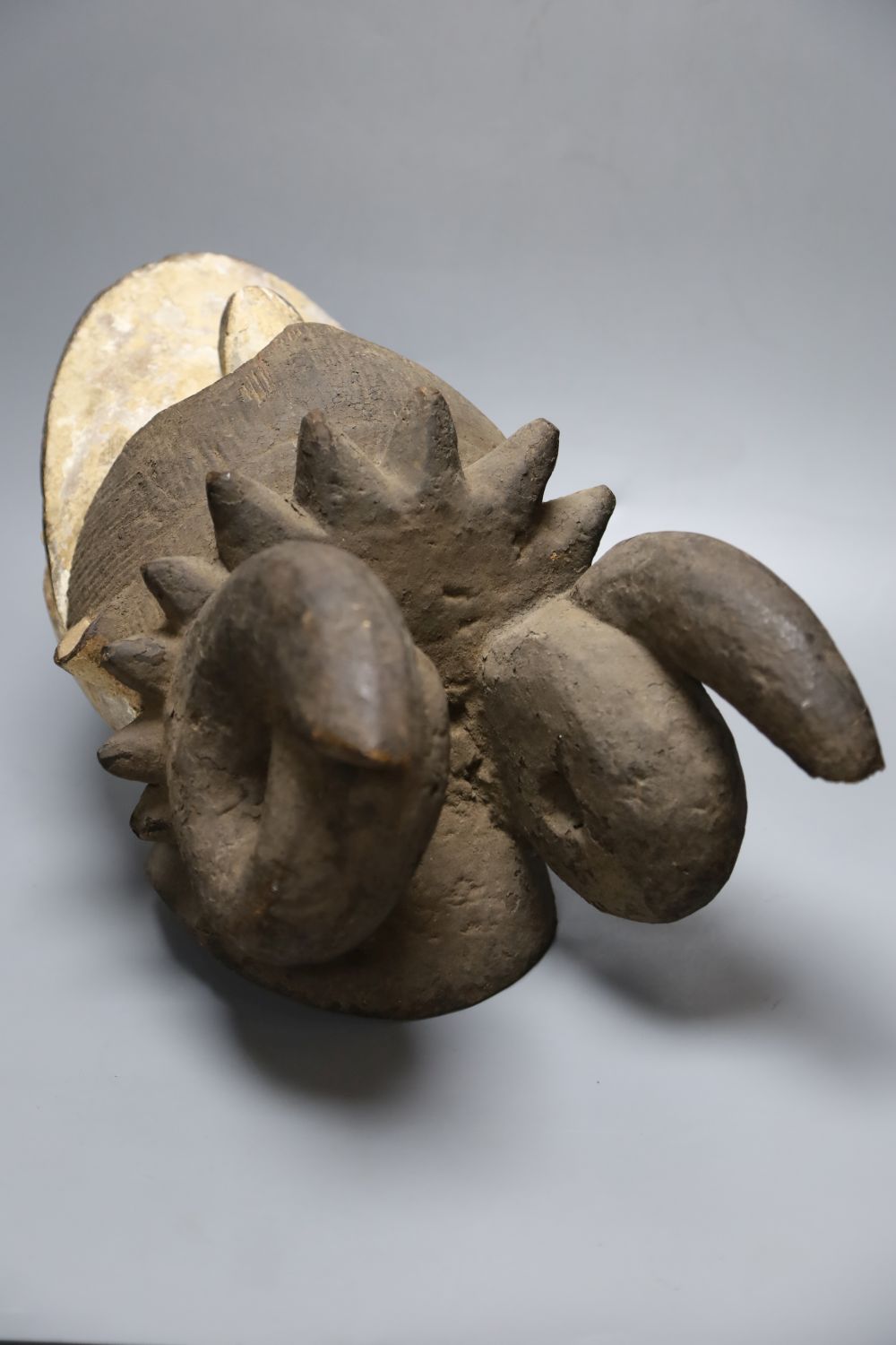 An Igbo painted wood horned mask, Nigeria